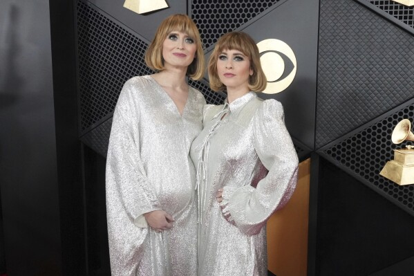 Jess Wolfe, left, and Holly Laessig of Lucius arrive at the 66th annual Grammy Awards on Sunday, Feb. 4, 2024, in Los Angeles. (Photo by Jordan Strauss/Invision/AP)