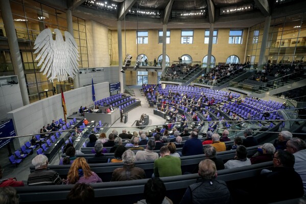 General view of the plenary chamber in the Bundestag, at the Reichstag building in Berlin, Germany, Thursday, Jan. 18, 2024. The German parliament on Thursday approved legislation that is intended to ease deportations of unsuccessful asylum-seekers as Chancellor Olaf Scholz seeks to defuse migration as a political problem. (Kay Nietfeld/dpa via AP)