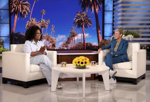 In this photo released by Warner Bros., talk show host Ellen DeGeneres appears with guest Oprah Winfrey during a taping of "The Ellen DeGeneres Show" at the Warner Bros. lot in Burbank, Calif., on April 26, 2022, scheduled to air on May 24. DeGeneres is taking her final bow on her syndicated daytime talk show, “The Ellen DeGeneres Show,” on Thursday, May 26, after almost two decades. (Michael Rozman/Warner Bros. via AP)