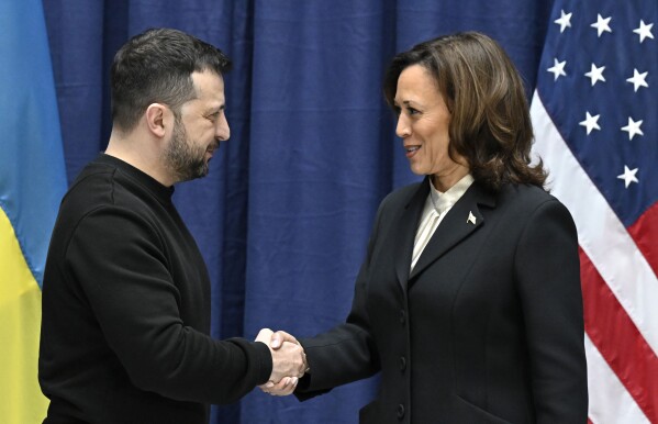 Ukrainian President Volodymyr Zelenskyy, left, and U.S. Vice President Kamala Harris shake hands at the end of a joint press conference at the Munich Security Conference (MSC) in Munich, Germany, Saturday Feb. 17, 2024. (Tobias Schwarz/Pool via AP)