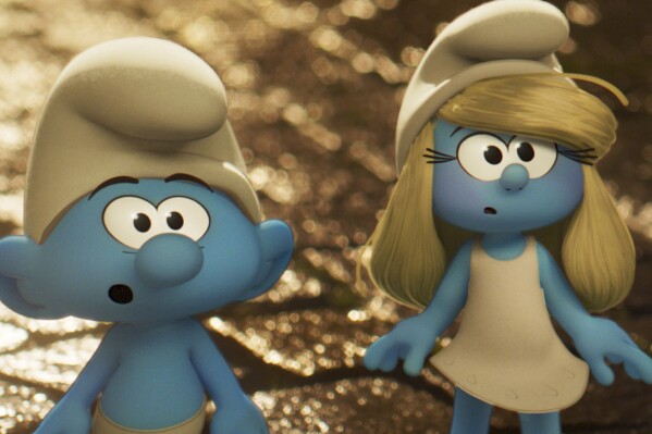 This image released by Paramount Animation shows No Name, voiced by James Corden, left, and Smurfette, voiced by Rihanna in a scene from "Smurfs." (Paramount Animation via AP)