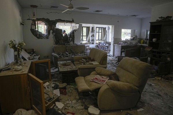A house damaged by Hamas militants is seen in Kibbutz Be'eri, Israel, Saturday, Oct. 14, 2023. The kibbutz was overrun by Hamas militants from the nearby Gaza Strip on Cot.7, when they killed and captured many Israelis. (AP Photo/Ariel Schalit)