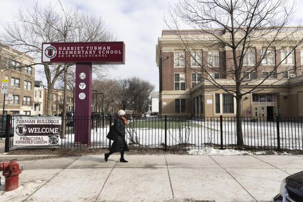 The new sign at Harriet Tubman Elementary School is displayed in Chicago, Monday, Feb. 14, 2022. The sign comes about a year after a group of parents successfully pushed for the school — long named after Swiss American biologist Louis Agassiz — to change the name to the Harriet Tubman Elementary School. (Anthony Vazquez/Chicago Sun-Times via AP)
