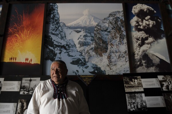 Moises Vega gives an interview at the Volcano Museum in Amecameca, Mexico, near the Popocatépetl volcano, Sunday, June 11, 2023. The 64-year-old Mexican says he can speak the sacred language of volcanoes to ask for good weather and a good crop. (AP Photo/Aurea Del Rosario)