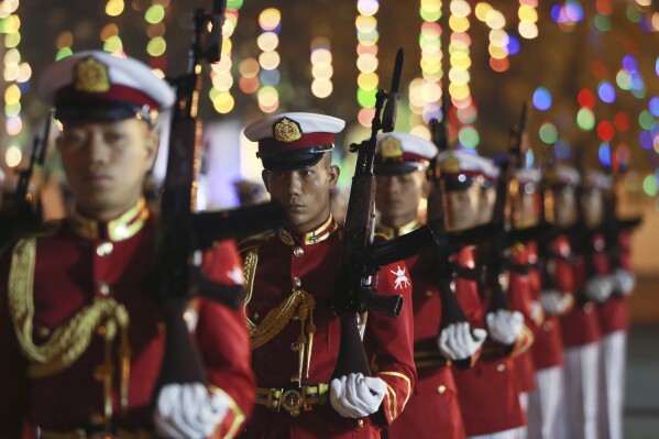 Members of an honor guard march during a ceremony to mark Myanmar's 76th anniversary of Union Day in Naypyitaw, Myanmar, Sunday, Feb. 12, 2023. (AP Photo/Aung Shine Oo)