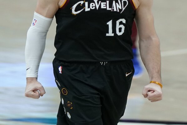 Cleveland Cavaliers' Cedi Osman reacts during double overtime of an NBA basketball game against the Brooklyn Nets, Wednesday, Jan. 20, 2021, in Cleveland. The Cavaliers won 147-135 in double-overtime. (AP Photo/Tony Dejak)
