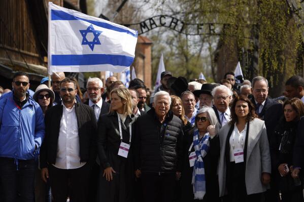 New England Patriots owner, Robert Kraft, front center, participates in the annual 'March of the Living', a trek between two former Nazi-run death camps, in Oswiecim, Poland, Tuesday, April 18, 2023 to mourn victims of the Holocaust and celebrate the existence of the Jewish state. (AP Photo/Michal Dyjuk)