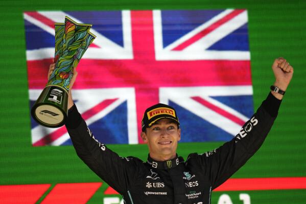 Mercedes driver George Russell, of Britain, celebrates his victory in the Brazilian Formula One Grand Prix at the Interlagos race track in Sao Paulo, Brazil, Sunday, Nov.13, 2022. (AP Photo/Andre Penner)
