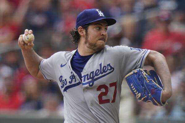 FILE - In this June 6, 2021, file photo, Los Angeles Dodgers starting pitcher Trevor Bauer delivers in the first inning of a baseball game against the Atlanta Braves in Atlanta. An attorney for Bauer told a judge that the Dodgers pitcher had every reason to believe that a woman wanted the rough treatment he gave her in two sexual encounters that led to her seeking a five-year restraining order against him. Lawyer Shawn Holley made the argument at a hearing Monday, Aug. 16, 2021, in Los Angeles. (AP Photo/Brynn Anderson, File)