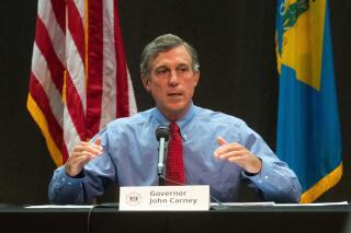 FILE - In this July 14, 2020, file photo, Delaware Gov. John Carney speaks during a briefing on the current status of the coronavirus pandemic, at the Carvel State Building in Wilmington, Del. Carney on Tuesday, May 24, 2022, vetoed a bill to legalize possession of up to one ounce of marijuana by adults for recreational use.  (Jerry Habraken/The News Journal via AP, File)