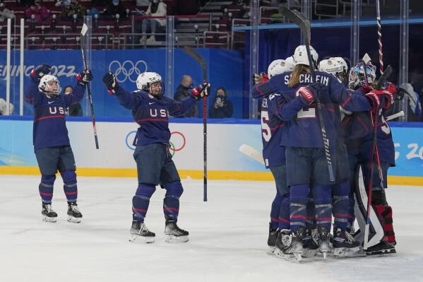 United States players celebrate after a 4-1 win against Finland in a women's semifinal hockey game at the 2022 Winter Olympics, Monday, Feb. 14, 2022, in Beijing. (AP Photo/Petr David Josek)