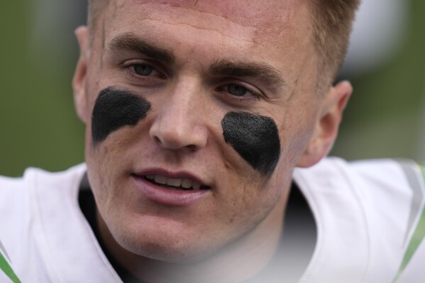 Oregon quarterback Bo Nix (10) looks on during the first half of an NCAA college football game against Utah Saturday, Oct. 28, 2023, in Salt Lake City. (AP Photo/Rick Bowmer)