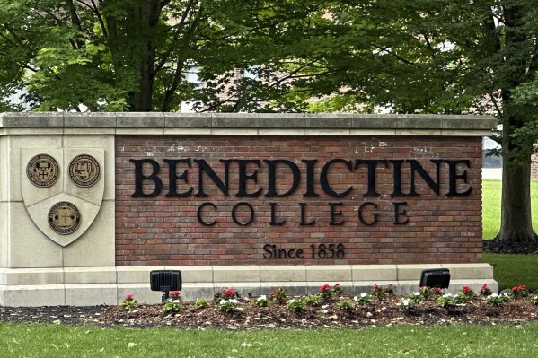 The Benedictine College sign is seen Wednesday, May 15, 2024, in Atchison, Kan., days after Kansas City Chiefs kicker Harrison Butker gave a commencement speech that has been gaining attention. Butker's speech has raised some eyebrows with his proclamations of conservative politics and Catholicism, but he received a standing ovation from graduates and other attendees of the commencement ceremony on Saturday, May 11. (Ǻ Photo/Nick Ingram)
