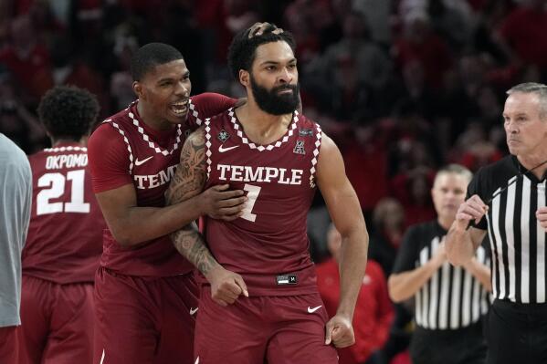 Temple's Damian Dunn (1) and Hysier Miller celebrate after an NCAA college basketball game against Houston Sunday, Jan. 22, 2023, in Houston. Temple won 56-55. (AP Photo/David J. Phillip)