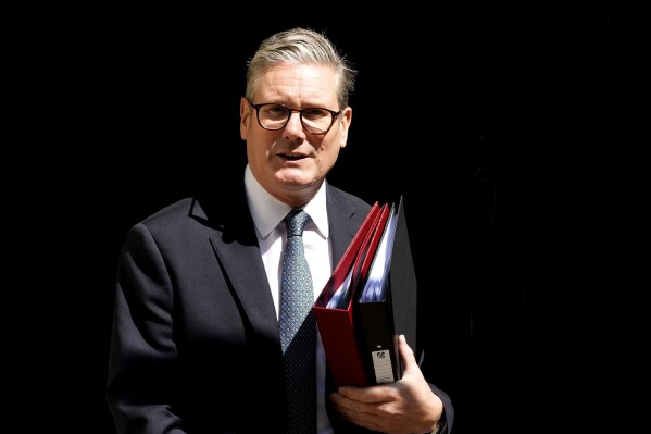 Britain's Prime Minister Keir Starmer leaves 10 Downing Street to attend the weekly Prime Ministers' Questions session in parliament in London, Wednesday, July 24, 2024. (ĢӰԺ Photo/Frank Augstein)