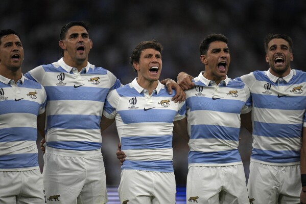 Argentina players sing their national anthem before the Rugby World Cup Pool D match between England and Argentina in the Stade de Marseille, Marseille, France Saturday, Sept. 9, 2023. (AP Photo/Daniel Cole)
