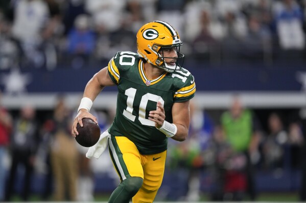Green Bay Packers quarterback Jordan Love looks to pass against the Dallas Cowboys during the first half of an NFL football game, Sunday, Jan. 14, 2024, in Arlington, Texas. (AP Photo/Sam Hodde)