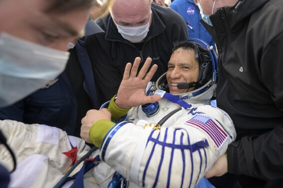 NASA astronaut Frank Rubio is helped out of the Soyuz MS-23 spacecraft just minutes after he and Russian cosmonauts Sergey Prokopyev and Dmitri Petelin, landed in a remote area near the town of Zhezkazgan, Kazakhstan on Wednesday, Sept. 27, 2023. The extended mission means that Rubio now holds the record for longest spaceflight by an American. (Bill Ingalls/NASA via AP)