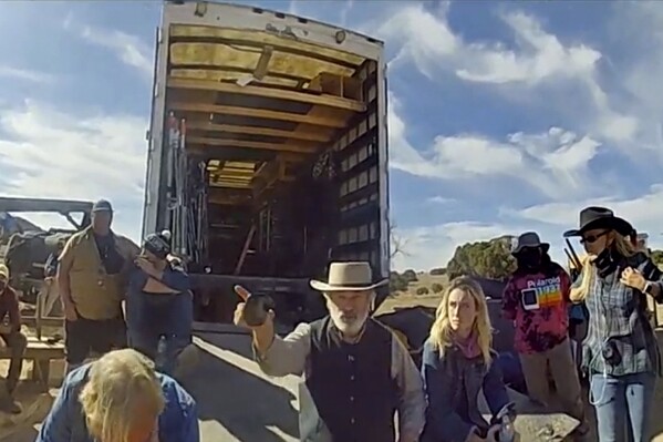FILE - In this image taken video released by the Santa Fe County Sheriff's Office, Alec Baldwin gestures while talking with investigators following a fatal shooting last year on a movie set in Santa Fe, N.M. A jury convicted movie armorer Hannah Gutierrez-Reed of involuntary manslaughter Wednesday, March 6, 2024, in the fatal shooting of cinematographer Halyna Hutchins by actor Alec Baldwin during a rehearsal on the set of the Western movie “Rust.” Baldwin has been indicted on a charge of involuntary manslaughter and has pleaded not guilty ahead of a July trial date. (Santa Fe County Sheriff's Office via AP, File)