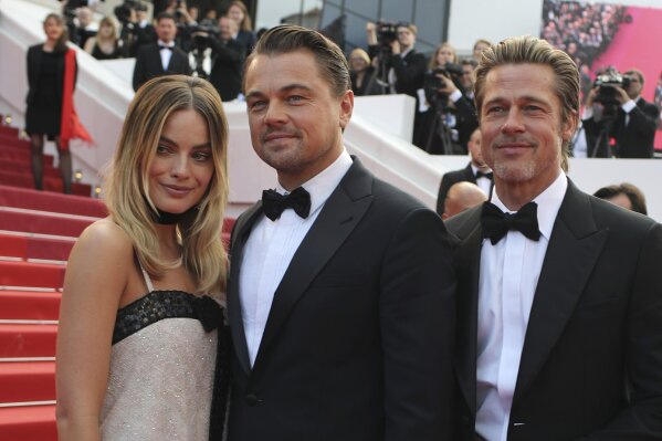 
              Actors Margot Robbie from left, Leonardo DiCaprio and Brad Pitt poses for photographers upon arrival at the premiere of the film 'Once Upon a Time in Hollywood' at the 72nd international film festival, Cannes, southern France, Tuesday, May 21, 2019. (AP Photo/Petros Giannakouris)
            