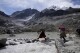 Suibel Gonzales, left, and her mother Lidia Huayllas, Aymara Indigenous women who make a living as mountain guides, walk on the Huayna Potosi glacier on the outskirts of El Alto, Bolivia, Sunday, Nov. 5, 2023. When they first started climbing the Andes peaks years ago, they could hear the ice crunching under their crampons. These days, it鈥檚 the sound of melted water running beneath their feet that they mostly listen to as they make their way up. (AP Photo/Juan Karita)