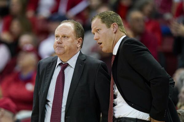 Wisconsin coach Greg Gard, left, talks with associate head coach Joe Krabbenhoft during the second half of the team's NCAA college basketball game against Penn State on Tuesday, Jan. 17, 2023, in Madison, Wis. (AP Photo/Andy Manis)