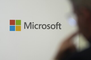 FILE - A logo of Microsoft is displayed during an event at the Chatham House think tank in London, Jan. 15, 2024. Microsoft said Wednesday that U.S. adversaries are beginning to use generative artificial intelligence to mount or organize offensive cyber operations. (AP Photo/Kin Cheung, File)