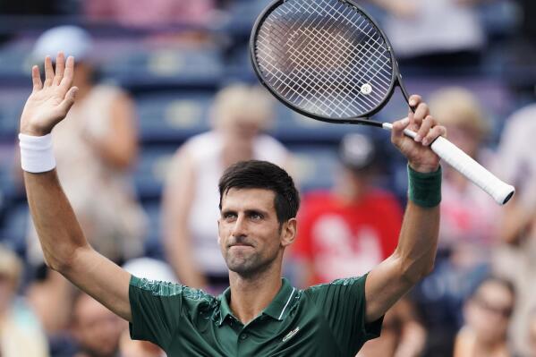 Novak Djokovic, of Serbia, celebrates defeating Peter Polansky, of Canada, at the Rogers Cup men's tennis tournament in Toronto, Wednesday, Aug. 8, 2018. (Mark Blinch/The Canadian Press via AP)