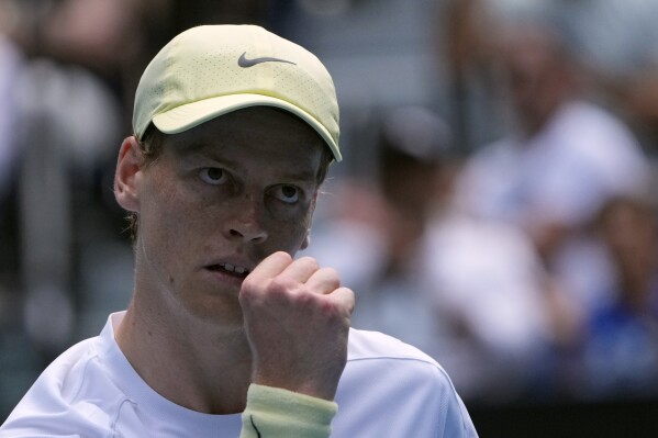 Jannik Sinner of Italy reacts after winning a point against Nicolas Jarry of Chile during their first round match at the Australian Open tennis championship in Melbourne, Australia, Monday, Jan. 13, 2025. (AP Photo/Asanka Brendon Ratnayake)