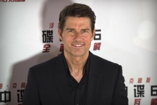 FILE - In this Aug. 29, 2018 file photo, Tom Cruise poses for photos during a red carpet event for the movie "Mission: Impossible - Fallout" at the Imperial Ancestral Temple in Beijing, China. Before the Wednesday, May 27, 2020 planned launch of two NASA astronauts aboard a SpaceX rocket, NASA administrator Jim Bridenstine, said, “I will tell you this: NASA has been in talks with Tom Cruise and, of course, his team, and we will do everything we can to make it a successful mission, including opening up the International Space Station," he told The Associated Press. (AP Photo/Mark Schiefelbein)