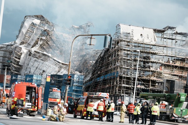 The outer wall of the Stock Exchange has collapsed towards Boersgade, Copenhagen, Thursday, April 18, 2024. A fire raged through one of Copenhagen’s oldest buildings on Tuesday, causing the collapse of the iconic spire of the 17th-century Old Stock Exchange as passersby rushed to help emergency services save priceless paintings and other valuables. (Thomas Traasdahl/Ritzau Scanpix via AP)