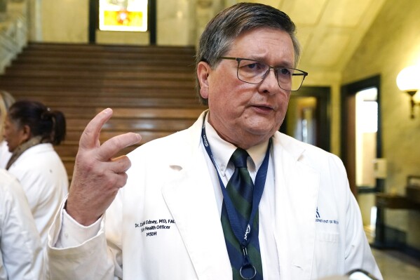 Following a news conference inside the Mississippi Capitol, Mississippi State Health Officer Dr. Daniel Edney speaks to reporters about what must be done to improve Mississippi's status as the nation's unhealthiest state across several metrics, Thursday, Jan. 18, 2024, in Jackson, Miss. (AP Photo/Rogelio V. Solis)