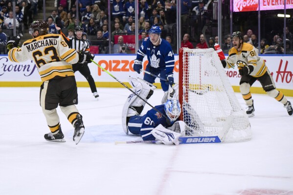 Marchand scores late in OT to lift Bruins to 4-3 win over Maple Leafs | AP News