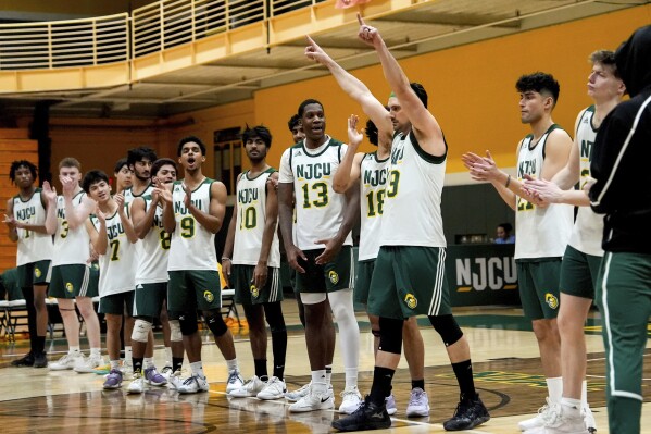 Damon LaSalle is introduced before a men's volleyball game against University of Mount Saint Vincent, Wednesday, March 5, 2025, at New Jersey City University in Jersey City, N.J. (AP Photo/Julia Demaree Nikhinson)