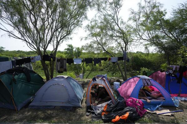 Venezuelan migrants rest inside their tents on the bank of the Rio Grande in Matamoros, Mexico, Sunday, May 14, 2023. As the U.S. ended its pandemic-era immigration restrictions, migrants are adapting to new asylum rules and legal pathways meant to discourage illegal crossings. (AP Photo/Fernando Llano)