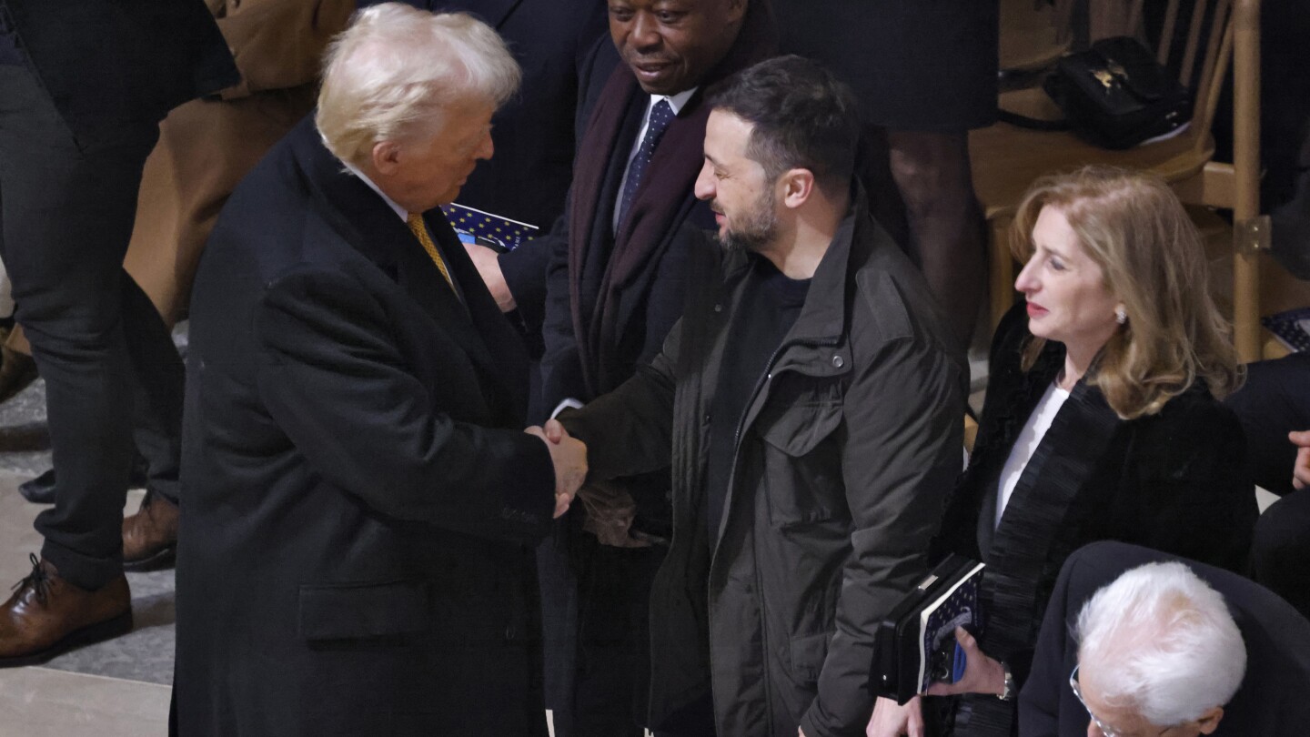 President-elect Donald Trump shakes hands with Ukraine's President Volodymyr Zelenskyy in Notre Dame Cathedral as France's iconic cathedral is formally reopening its doors for the first time since a devastating fire nearly destroyed the 861-year-old landmark in 2019, Saturday Dec.7, 2024 in Paris ( Ludovic Marin, Pool via AP)