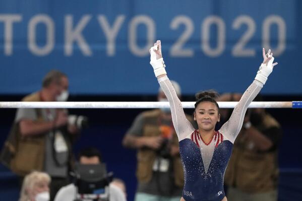 FILE - Sunisa Lee, of the United States, finishes on the uneven bars during the artistic gymnastics women's all-around final at the 2020 Summer Olympics, July 29, 2021, in Tokyo. The 2020 women's all-around gymnastics champion announced Tuesday, Nov. 15, 2022, that she will return to training at the elite level following the end of her sophomore season at Auburn next spring. (AP Photo/Ashley Landis, File)