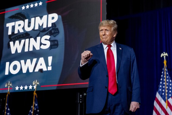 Republican presidential candidate former President Donald Trump takes the stage at a caucus night party in Des Moines, Iowa, Monday, Jan. 15, 2024. (AP Photo/Andrew Harnik)