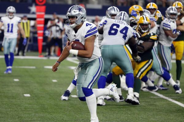 Dallas Cowboys quarterback Dak Prescott (4) keeps the ball and runs for a touchdown against the Green Bay Packers in the second half of an NFL football game, Sunday, Oct. 8, 2017, in Arlington, Texas. (AP Photo/Michael Ainsworth)