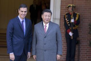 FILE - Chinese President Xi Jinping, right, stands with Spain's Prime Minister Pedro Sanchez at the Moncloa Palace in Madrid, Spain, Wednesday, Nov. 28, 2018. Chinese leader Xi Jinping has invited Spain’s Prime Minister Pedro Sánchez to Beijing on a state visit as Xi tries to galvanize support for a peace plan in Ukraine. Spain’s Minister for the Presidency, Félix Bolaños, confirmed late Wednesday, March 22, 2023, that Sánchez would visit China on March 30 and 31st. (AP Photo/Paul White, File)