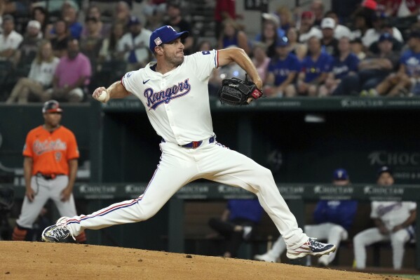 Texas Rangers starting pitcher Max Scherzer works against the Baltimore Orioles during the first inning of a baseball game Saturday, July 20, 2024, in Arlington, Texas. (ĢӰԺ Photo/Jeffrey McWhorter)