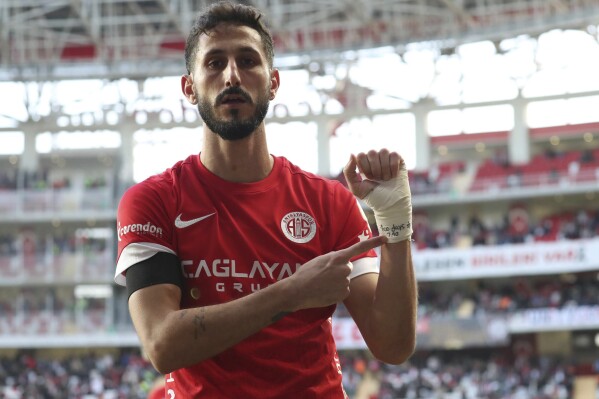 Antalyaspor's Sagiv Jehezkel points a message in his bandage that reads: 