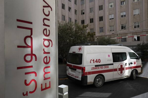 A Lebanese Red Cross ambulance enters the emergency building of the American University hospital, were some of the victims who were wounded on Monday by their exploded handheld pagers receive treatment, in Beirut, Lebanon, Wednesday, Sept. 18, 2024. (AP Photo/Hussein Malla)