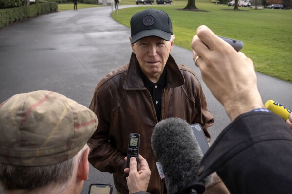 President Joe Biden speaks to reporters as he leaves the White House to go to the Camp David presidential retreat, near Thurmont, Md., Saturday, Jan. 13, 2024, in Washington. (AP Photo/Mark Schiefelbein)