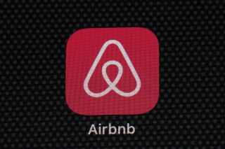 FILE - The Airbnb app icon is displayed on an iPad screen in Washington, D.C., on May 8, 2021. Airbnb reports earnings on Wednesday, Nov. 1, 2023. Short-term rental platform Airbnb has agreed to pay 576 million euros ($621 million) to settle a years-long dispute over unpaid taxes in Italy but said it won’t try to recover the money from its hosts. (AP Photo/Patrick Semansky, File)