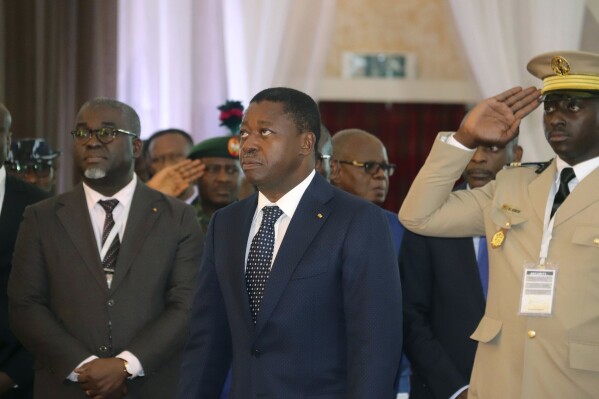 FILE - Togo's President, Faure Gnassingbé, centre, looks on, prior to the start of the ECOWAS meeting, in Abuja, Nigeria, Saturday, Feb. 24, 2024. Togolese voters headed to the polls on Monday, April 29, 2024, to vote in the country's parliamentary elections that will test support for a proposed new constitution that would scrap future presidential elections and give lawmakers the power to choose the president instead. (Ǻ Photo/Gbemiga Olamikan, File)