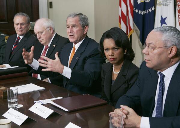 FILE - In this Jan. 5, 2006 file photo, President Bush, center, meets with Secretaries of State and Defense in the Roosevelt Room at the White House. From left to right are Secretary of Defense Donald H. Rumsfeld, Vice President Dick Cheney, Bush, Secretary of State Condoleezza Rice, and former Secretary of State Colin Powell.  Powell, former Joint Chiefs chairman and secretary of state, has died from COVID-19 complications. In an announcement on social media Monday, the family said Powell had been fully vaccinated. He was 84.  (AP Photo/Evan Vucci)