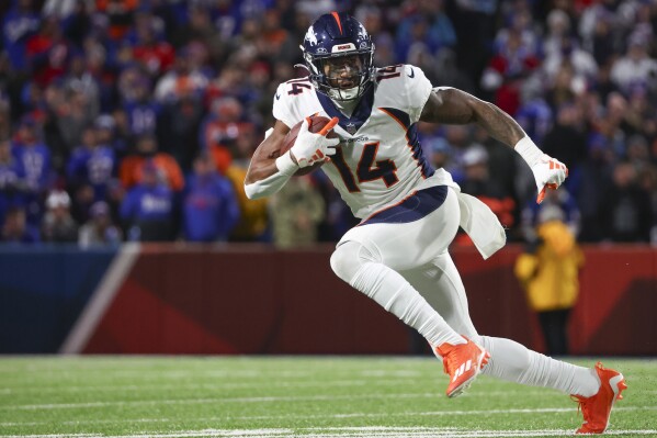 Denver Broncos' Courtland Sutton carries the ball during the second half of an NFL football game against the Buffalo Bills, Monday, Nov. 13, 2023, in Orchard Park, N.Y. (AP Photo/Jeffrey T. Barnes)