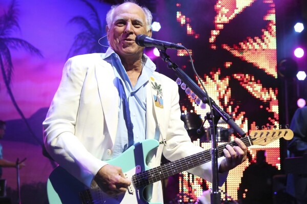 FILE - Jimmy Buffett performs at the after party for the premiere of "Jurassic World" in Los Angeles, on June 9, 2015. “Margaritaville” singer-songwriter Jimmy Buffett has died at age 76. A statement on Buffett's official website and social media pages says the singer died Friday, Sept. 1, 2023 “surrounded by his family, friends, music and dogs”. (Photo by Matt Sayles/Invision/AP, File)