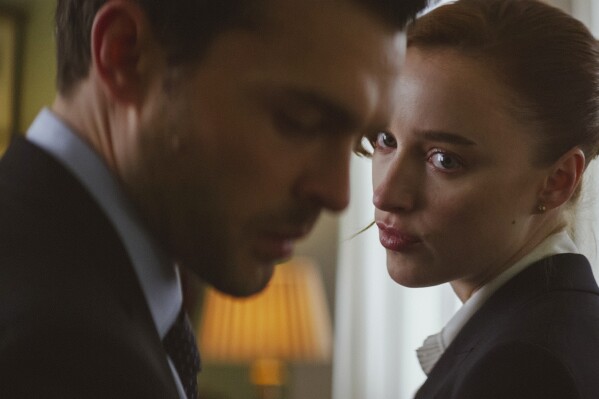 This image released by Netflix shows Alden Ehrenreich, left, and Phoebe Dynevor in a scene from "Fair Play." (Netflix via AP)